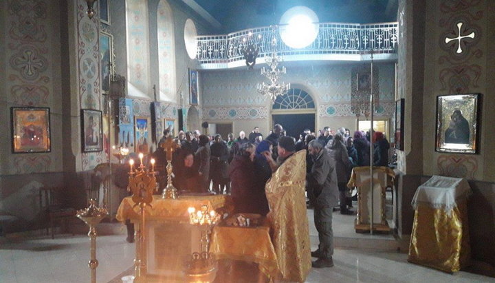 Believers and rector of the temple in the village of Tovtry doing the round-the-clock prayerful standing