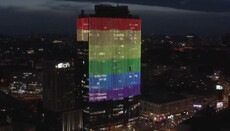 High-rise building in Kyiv centre illuminated with LGBT flag colours