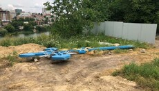 A worship cross undercut near the church to install a flag In Vinnytsia