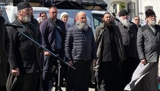 His Beatitude Onuphry prays with the faithful while standing in the Lavra