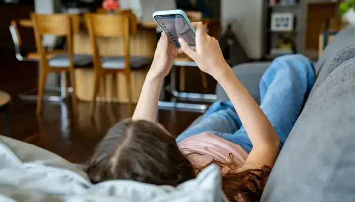 A teenager with a mobile phone. Photo: Getty Images