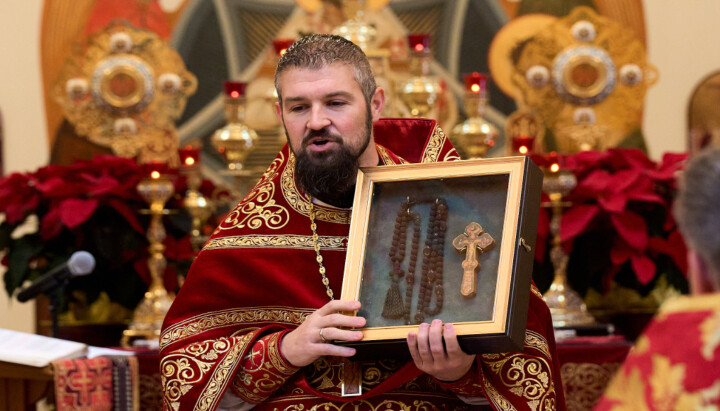 Fr. Gabriel Bilas with the prayer rope and blessing cross. Photo: St. Mary Magdalene Orthodox Church/Facebook