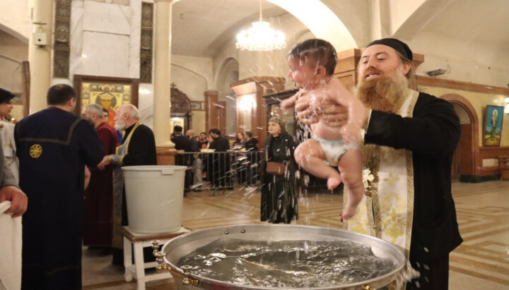 A child is baptized in Georgia on Nov. 23, 2025. Photo: Orthodoxia News Agency