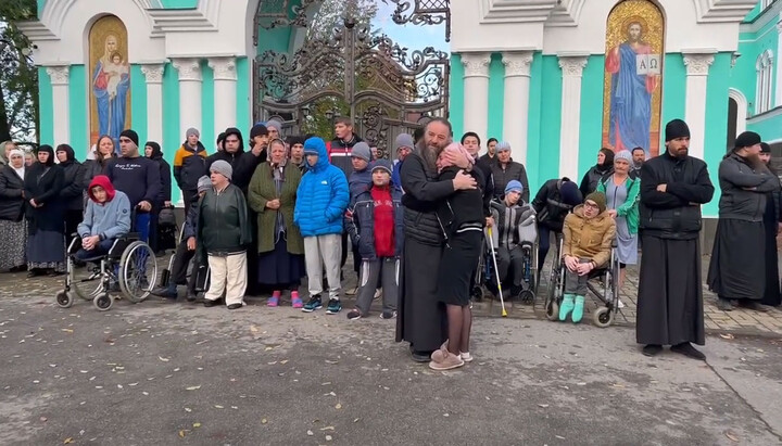 Met. Longin comforts one of his adopted daughters. Photo: pravlife.org
