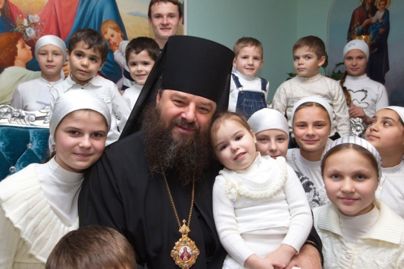 Met. Longin with several of his adopted children, many of whom were abandoned due to disabilities.